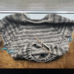 Photo of a sweater being knitted.