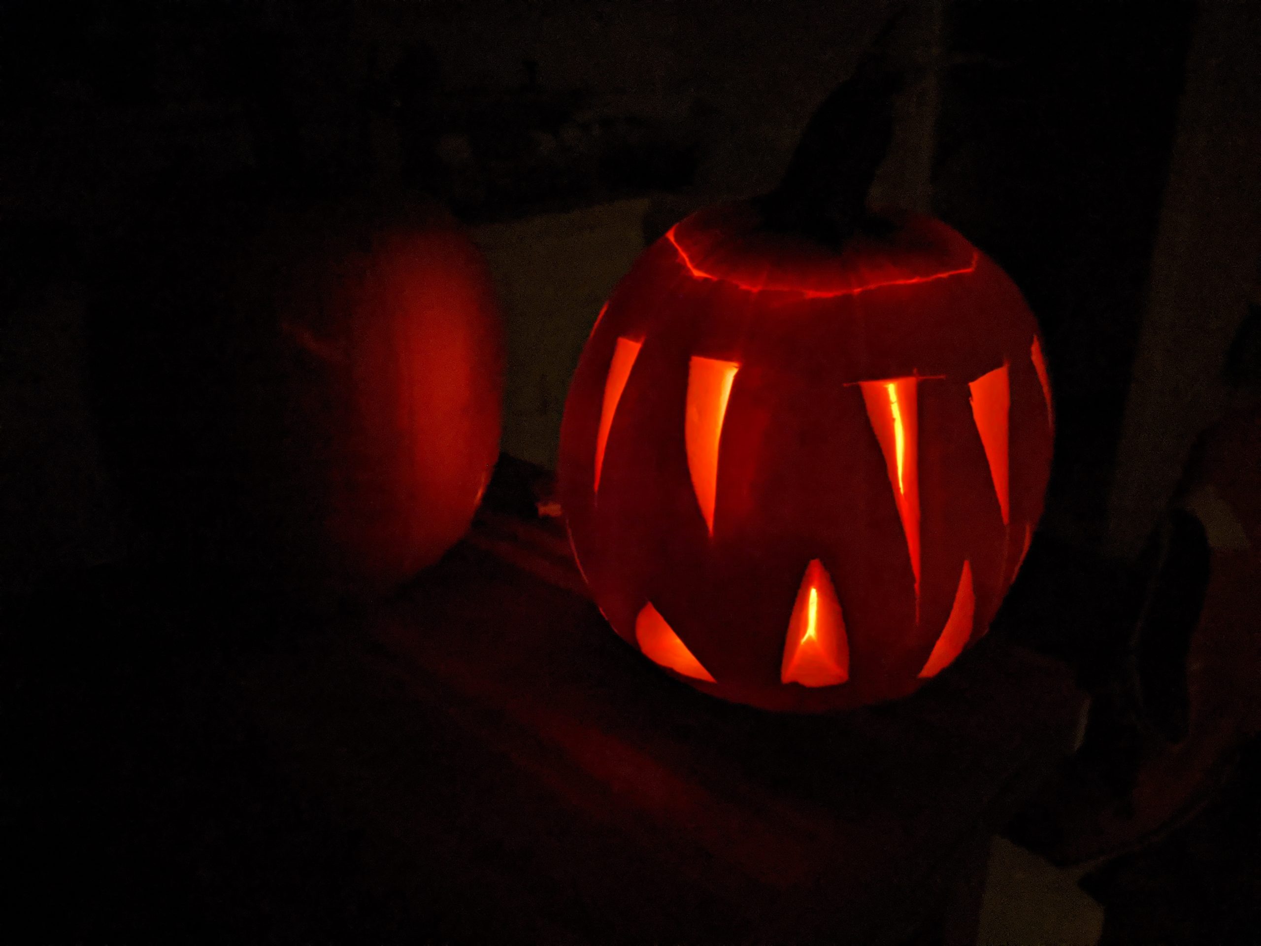 Picture of Halloween jack-o-lantern glowing in dark.